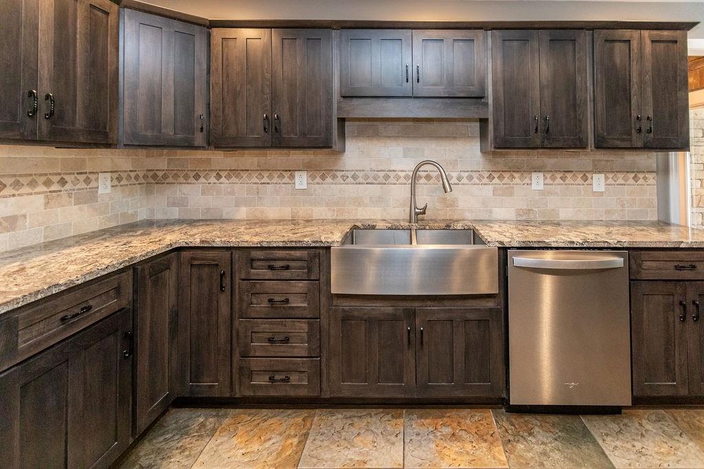 159 Reservoir Hill Road Uniontown, PA 15401 - Photo 20 of 50 a kitchen with granite countertop wooden cabinets and a sink