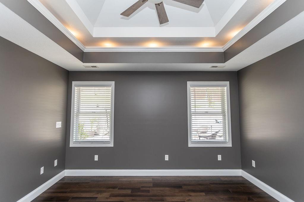 159 Reservoir Hill Road Uniontown, PA 15401 - Photo 22 of 50 an empty room with wooden floor and windows