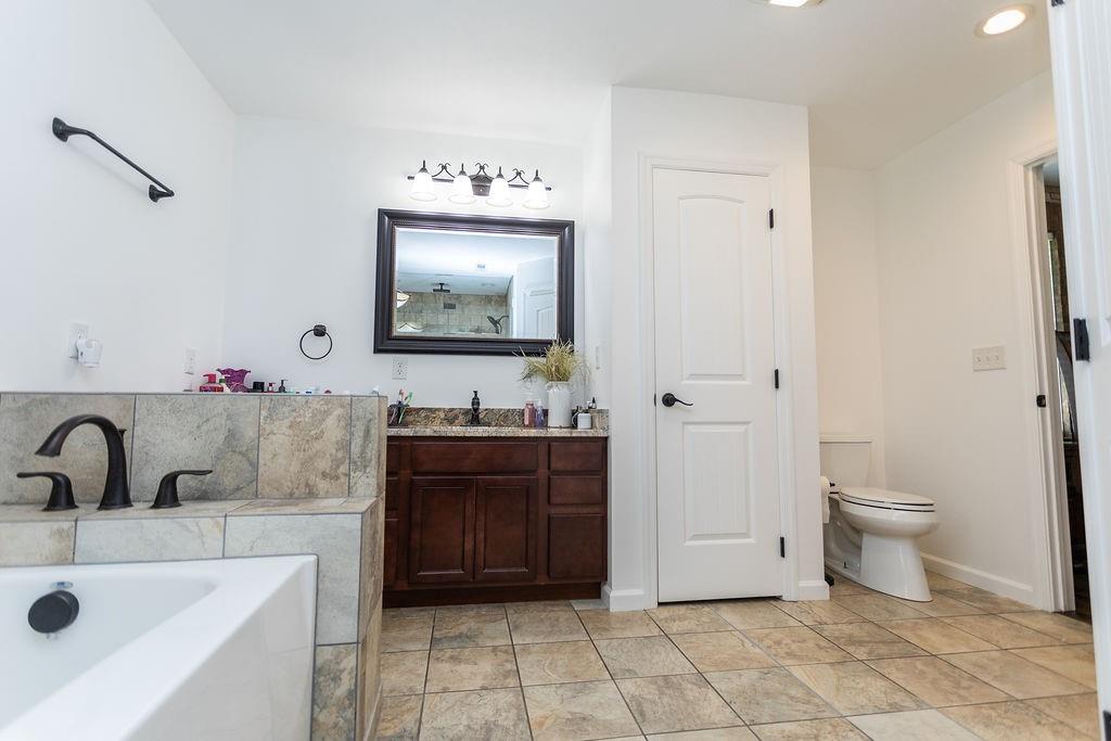 159 Reservoir Hill Road Uniontown, PA 15401 - Photo 34 of 50 a bathroom with a sink a toilet and mirror