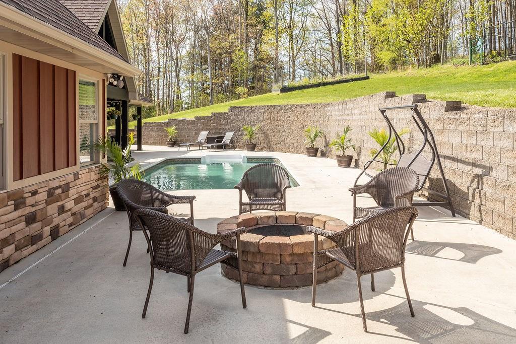 159 Reservoir Hill Road Uniontown, PA 15401 - Photo 38 of 50 a view of a chairs and table in the patio