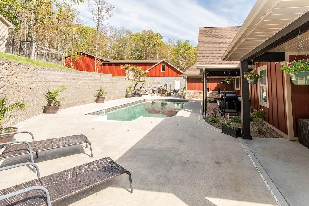 159 Reservoir Hill Road Uniontown, PA 15401 - Photo 39 of 50 a view of a patio with swimming pool table and chairs