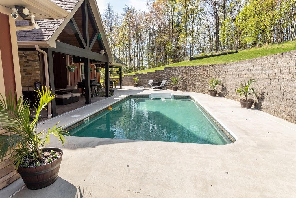 159 Reservoir Hill Road Uniontown, PA 15401 - Photo 41 of 50 a view of a backyard with swimming pool