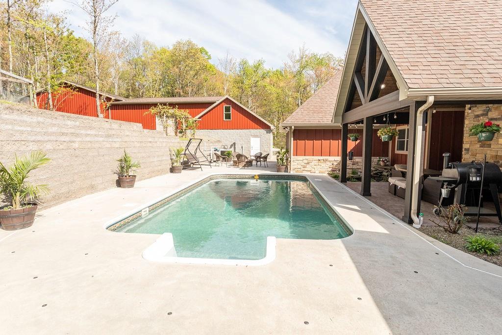 159 Reservoir Hill Road Uniontown, PA 15401 - Photo 42 of 50 an outdoor space with furniture and white umbrellas