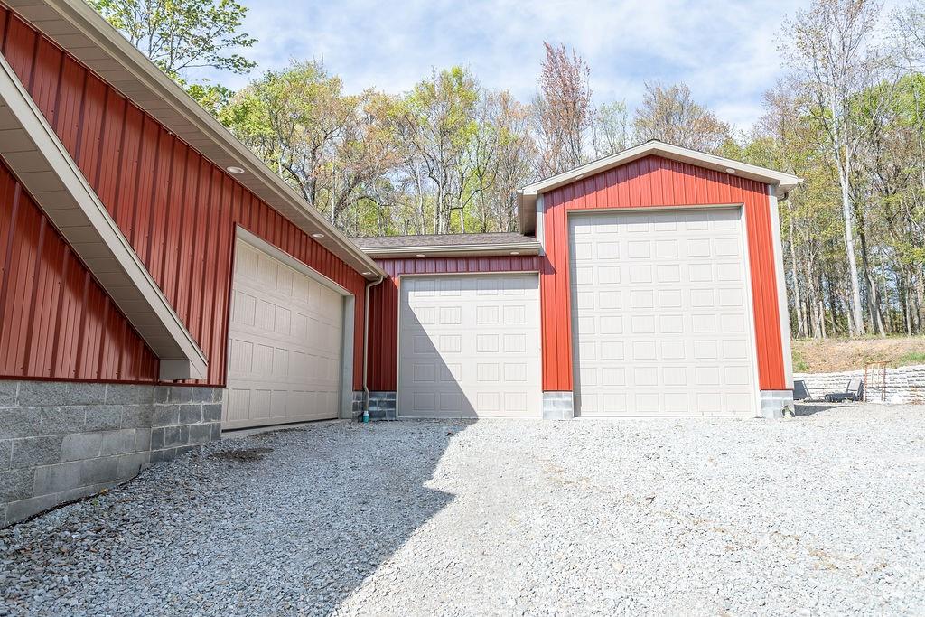 159 Reservoir Hill Road Uniontown, PA 15401 - Photo 47 of 50 a view of a house with a small yard and wooden fence