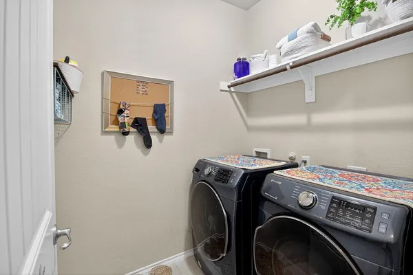 a utility room with dryer and washer