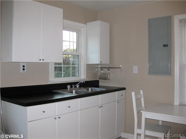 5407 Colleen Road Sandston, VA 23150 - Photo 2 of 11 a kitchen with granite countertop white cabinets and sink