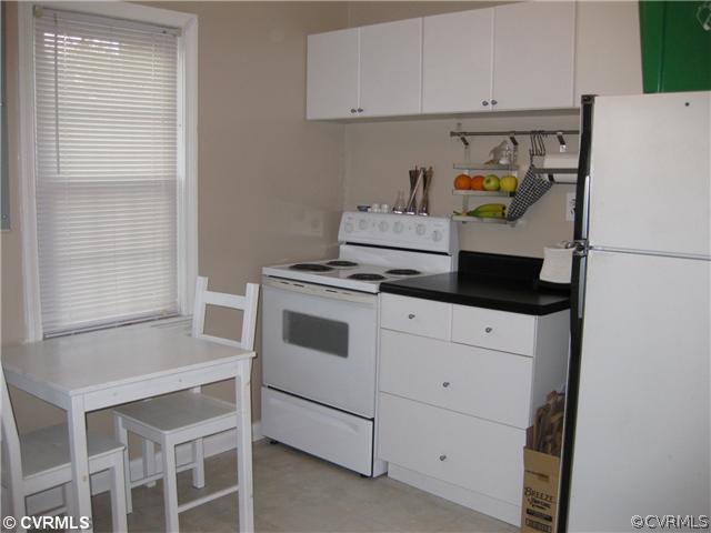 5407 Colleen Road Sandston, VA 23150 - Photo 3 of 11 a white refrigerator freezer sitting in a kitchen