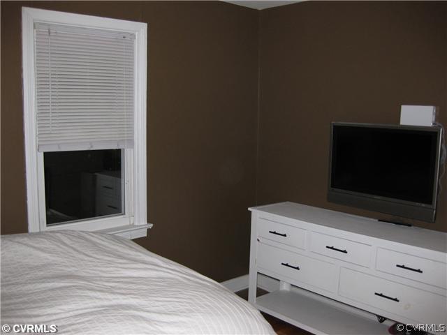 5407 Colleen Road Sandston, VA 23150 - Photo 8 of 11 a bedroom with a bed and a flat screen tv