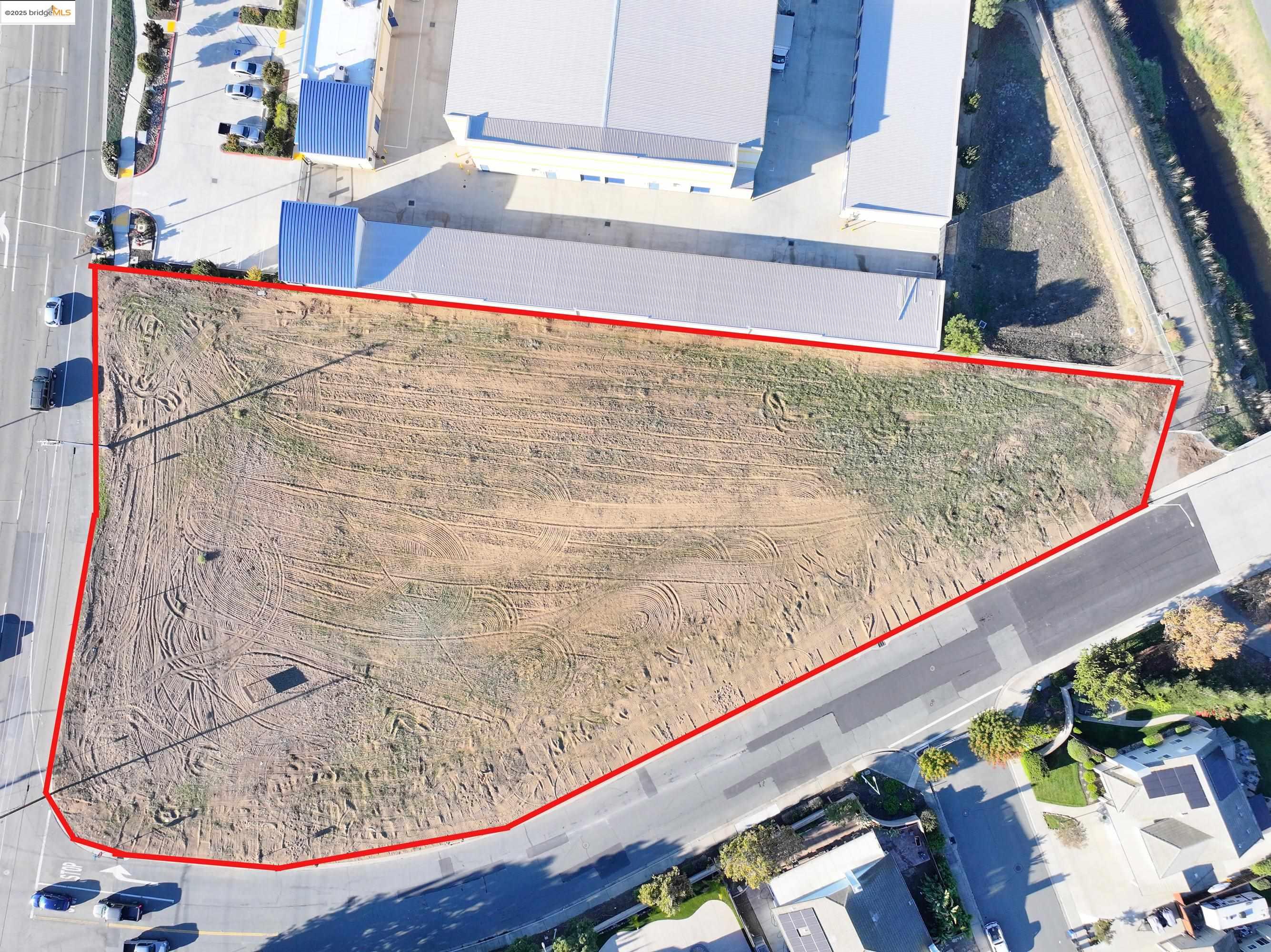 0 Main Street Oakley, CA 94561 - Photo 3 of 9 Aerial view of property and surrounding area featuring property boundaries highlighted