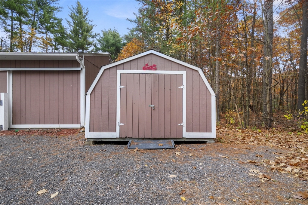 79 Whitney Road Shirley, MA 01464 - Photo 31 of 35 a view of a small house with a small yard