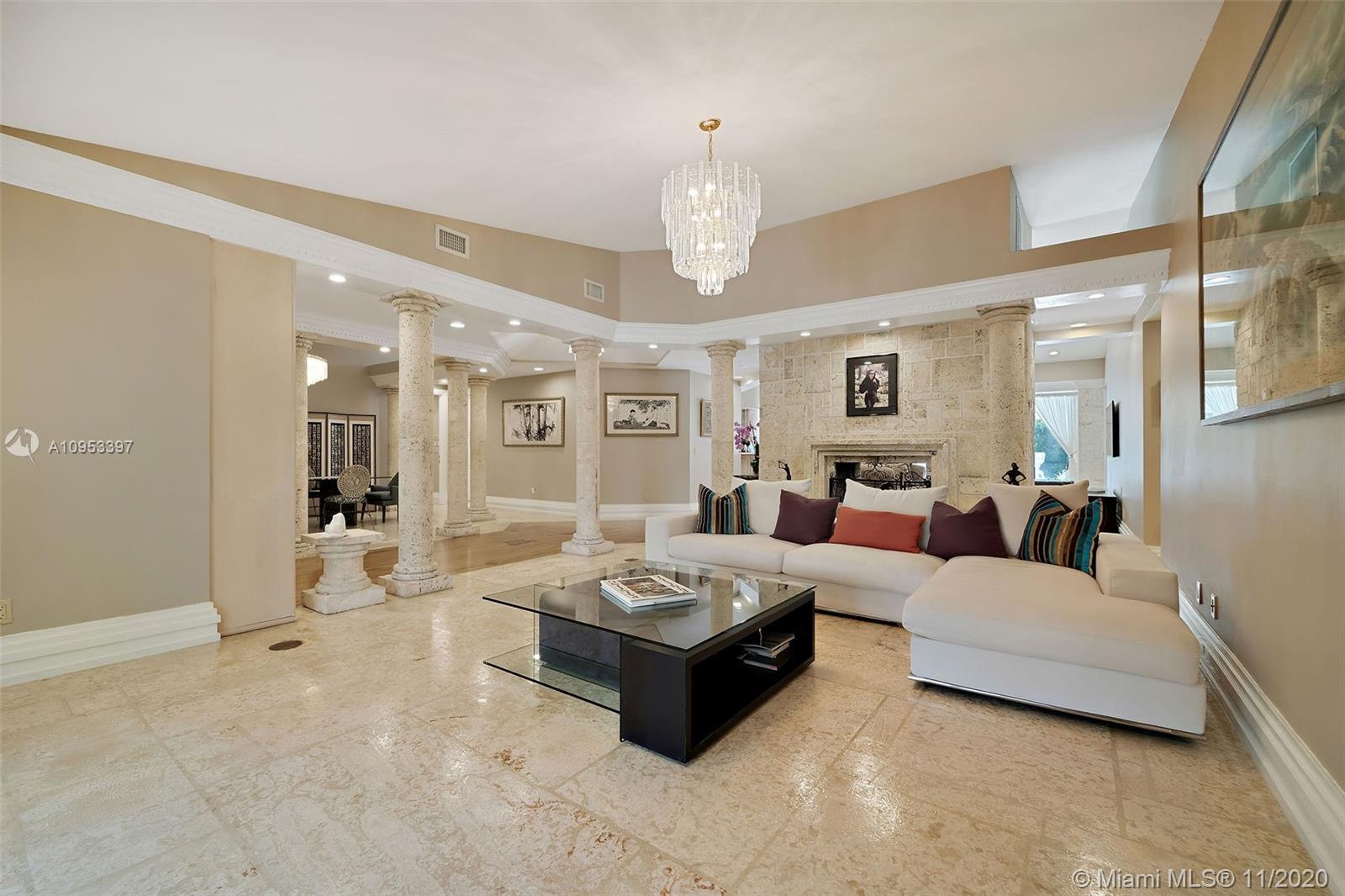 9100 Southwest 103rd Street Miami, FL 33176 - Photo 12 of 47 a living room with furniture and a chandelier
