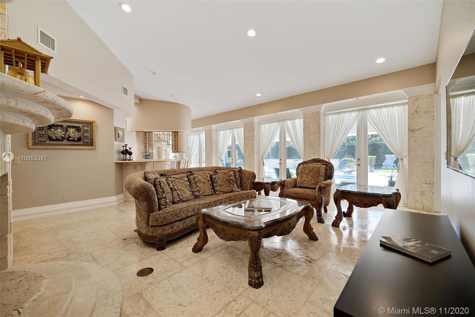 9100 Southwest 103rd Street Miami, FL 33176 - Photo 24 of 47 a living room with furniture and a large window