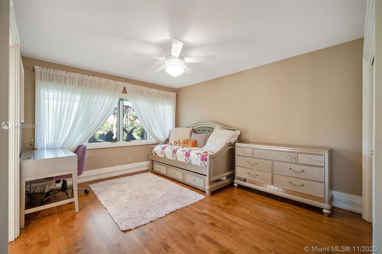 9100 Southwest 103rd Street Miami, FL 33176 - Photo 26 of 47 a bedroom with furniture and a large window
