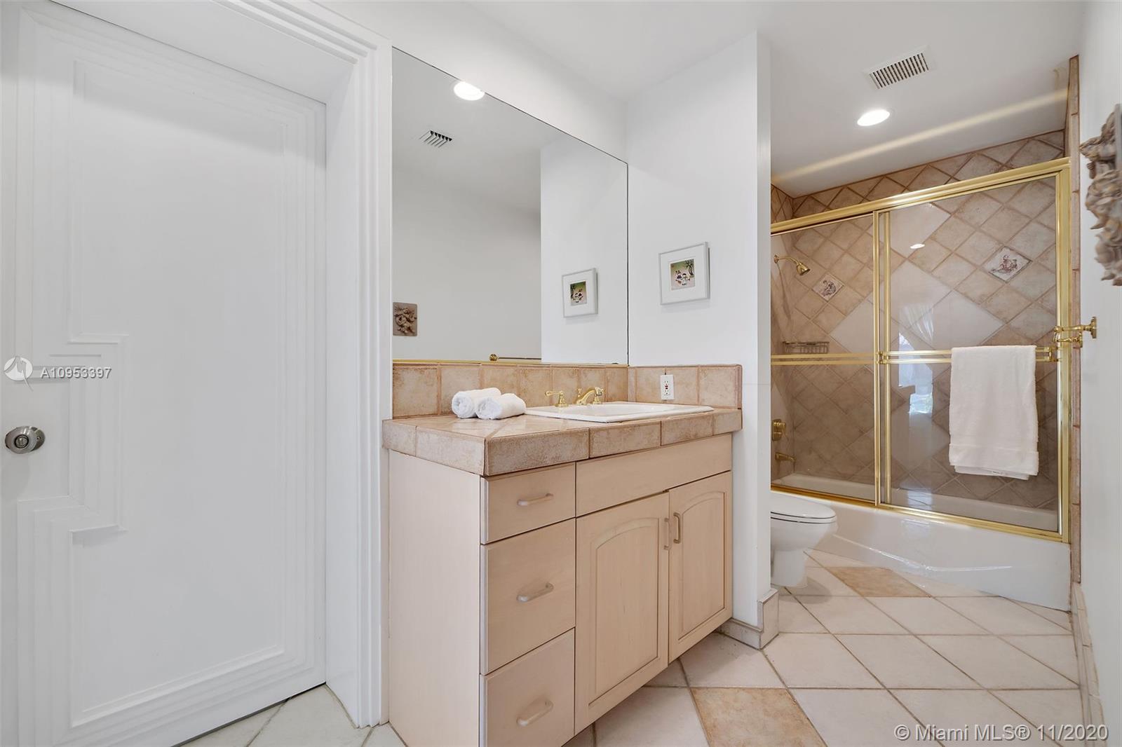 9100 Southwest 103rd Street Miami, FL 33176 - Photo 35 of 47 a bathroom with a sink and a mirror