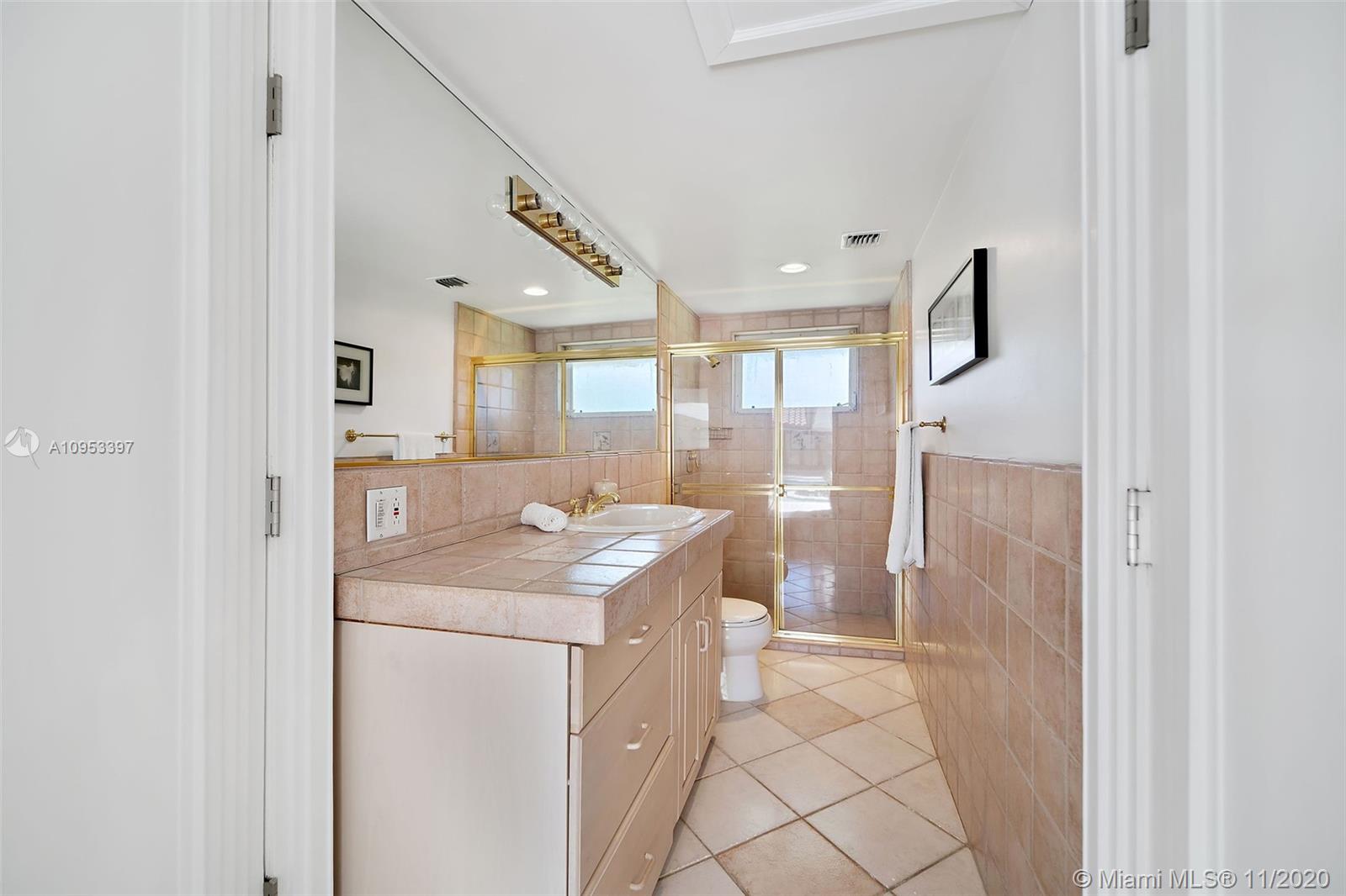 9100 Southwest 103rd Street Miami, FL 33176 - Photo 36 of 47 a bathroom with a sink a toilet and shower