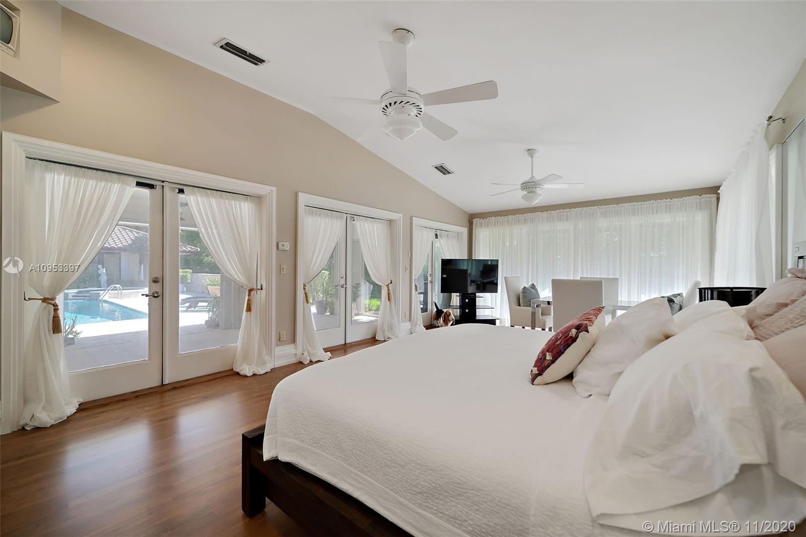 9100 Southwest 103rd Street Miami, FL 33176 - Photo 38 of 47 a bedroom with a large bed and a large window