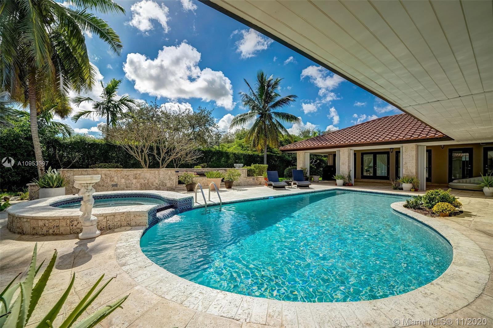 9100 Southwest 103rd Street Miami, FL 33176 - Photo 39 of 47 a view of a house with swimming pool and sitting area