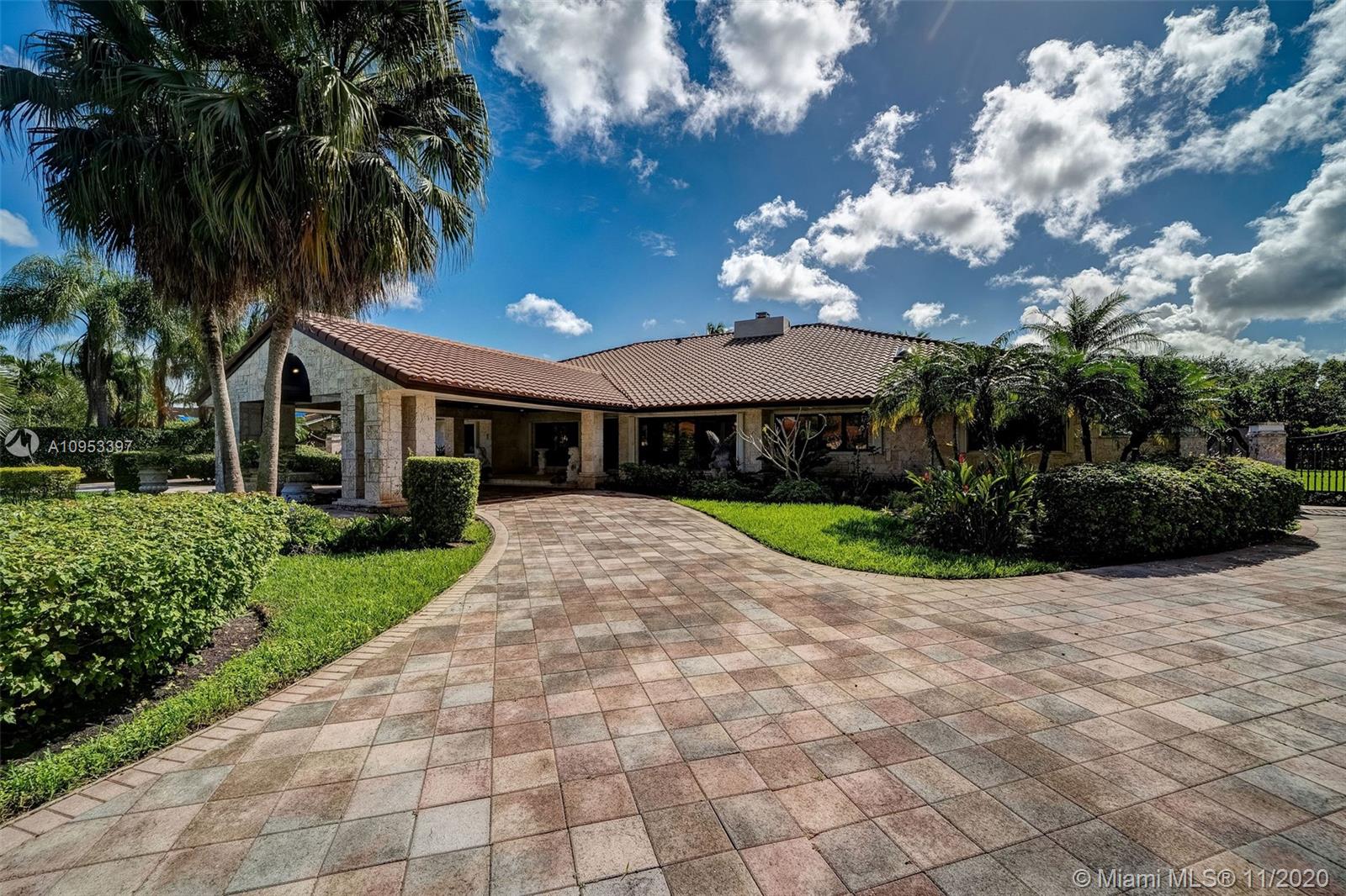 9100 Southwest 103rd Street Miami, FL 33176 - Photo 5 of 47 a view of a house with a patio