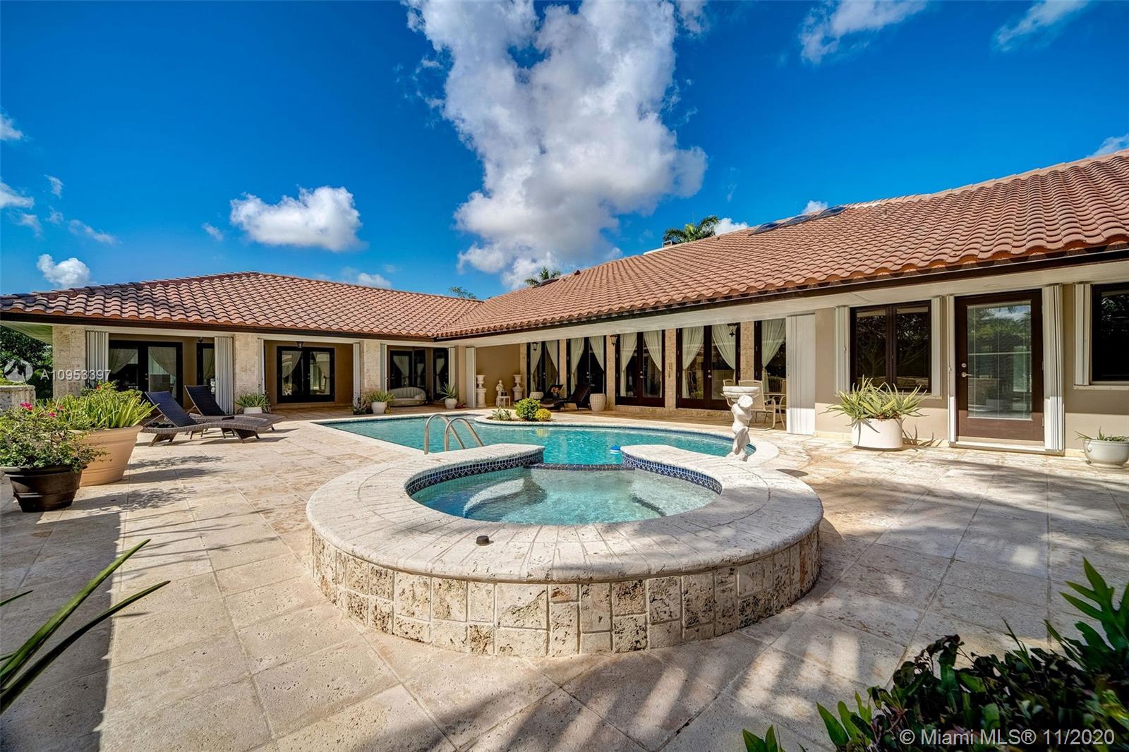 9100 Southwest 103rd Street Miami, FL 33176 - Photo 41 of 47 a view of a house with swimming pool and porch