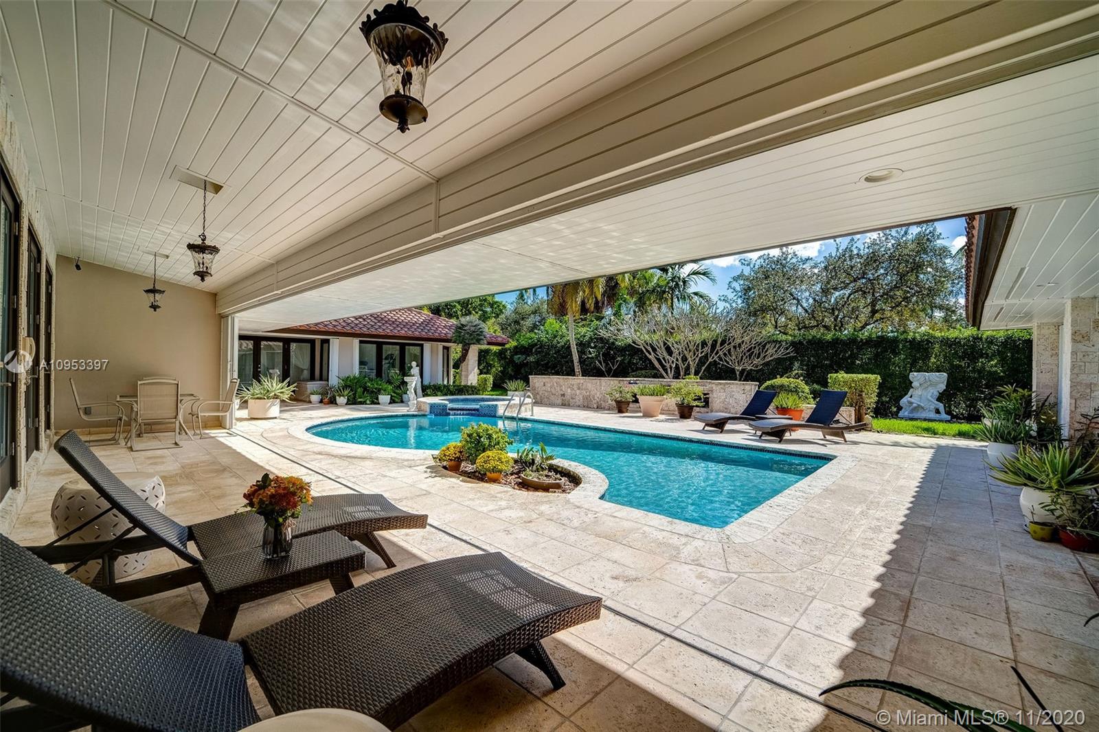 9100 Southwest 103rd Street Miami, FL 33176 - Photo 43 of 47 a view of a swimming pool and lounge chairs
