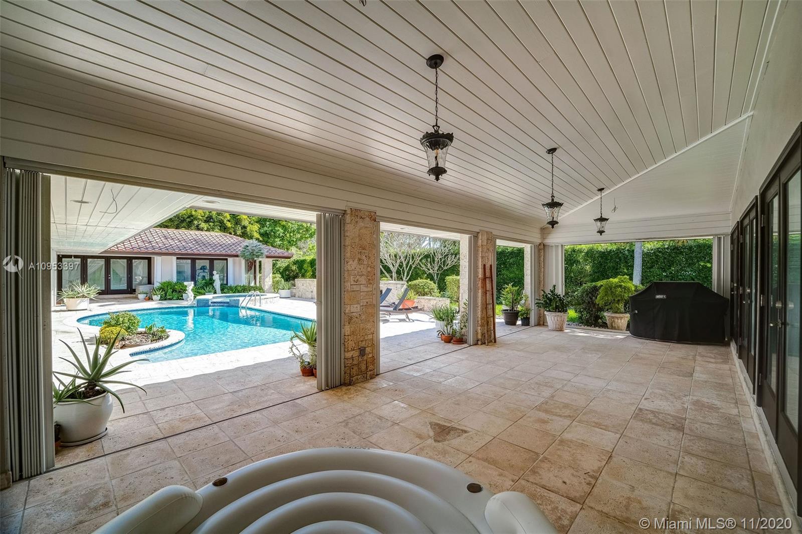 9100 Southwest 103rd Street Miami, FL 33176 - Photo 45 of 47 a view of a house with a swimming pool outdoor seating