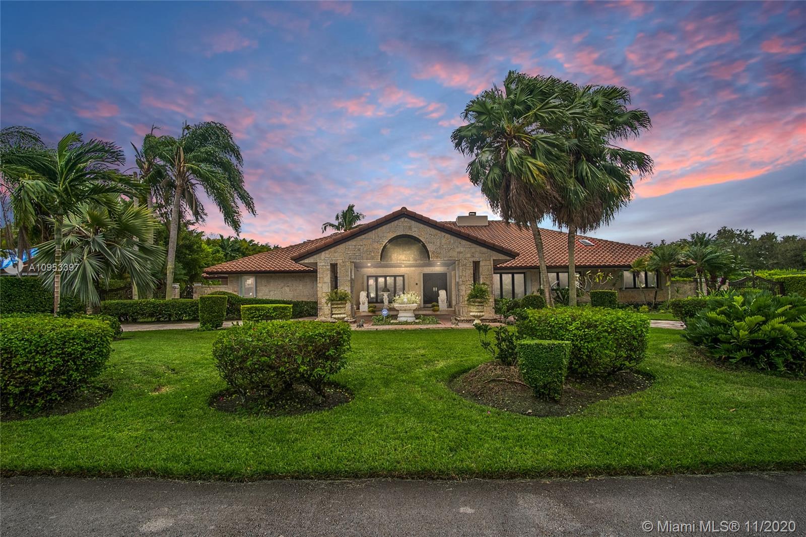 9100 Southwest 103rd Street Miami, FL 33176 - Photo 47 of 47 a front view of a house with garden
