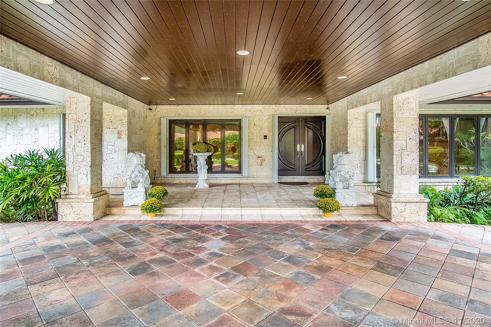 9100 Southwest 103rd Street Miami, FL 33176 - Photo 6 of 47 a view of a house with a patio