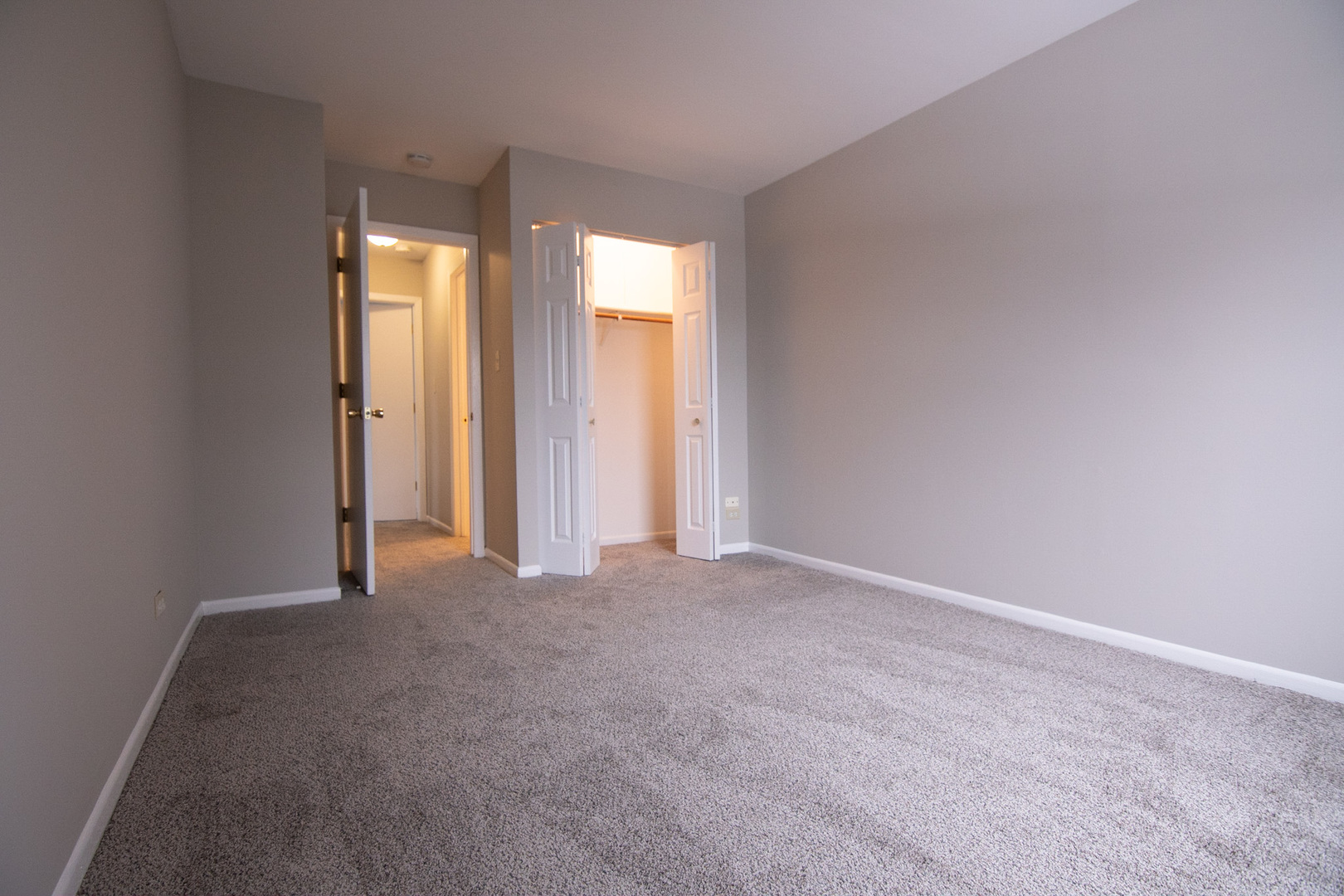 232 Butternut Lane, Unit 232 Streamwood, IL 60107 - Photo 11 of 16 an empty room with windows and closet