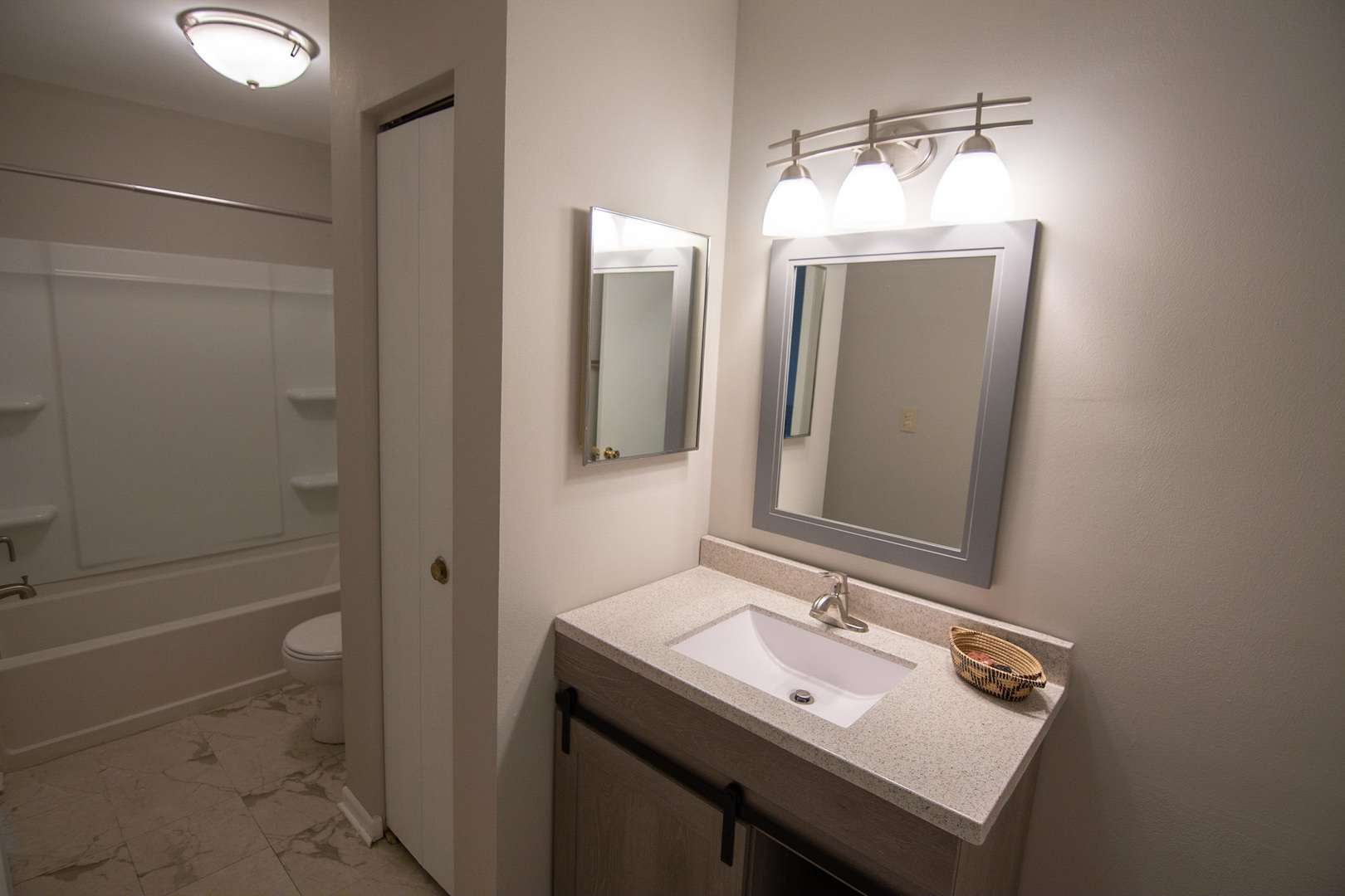 232 Butternut Lane, Unit 232 Streamwood, IL 60107 - Photo 12 of 16 a bathroom with a sink and a mirror