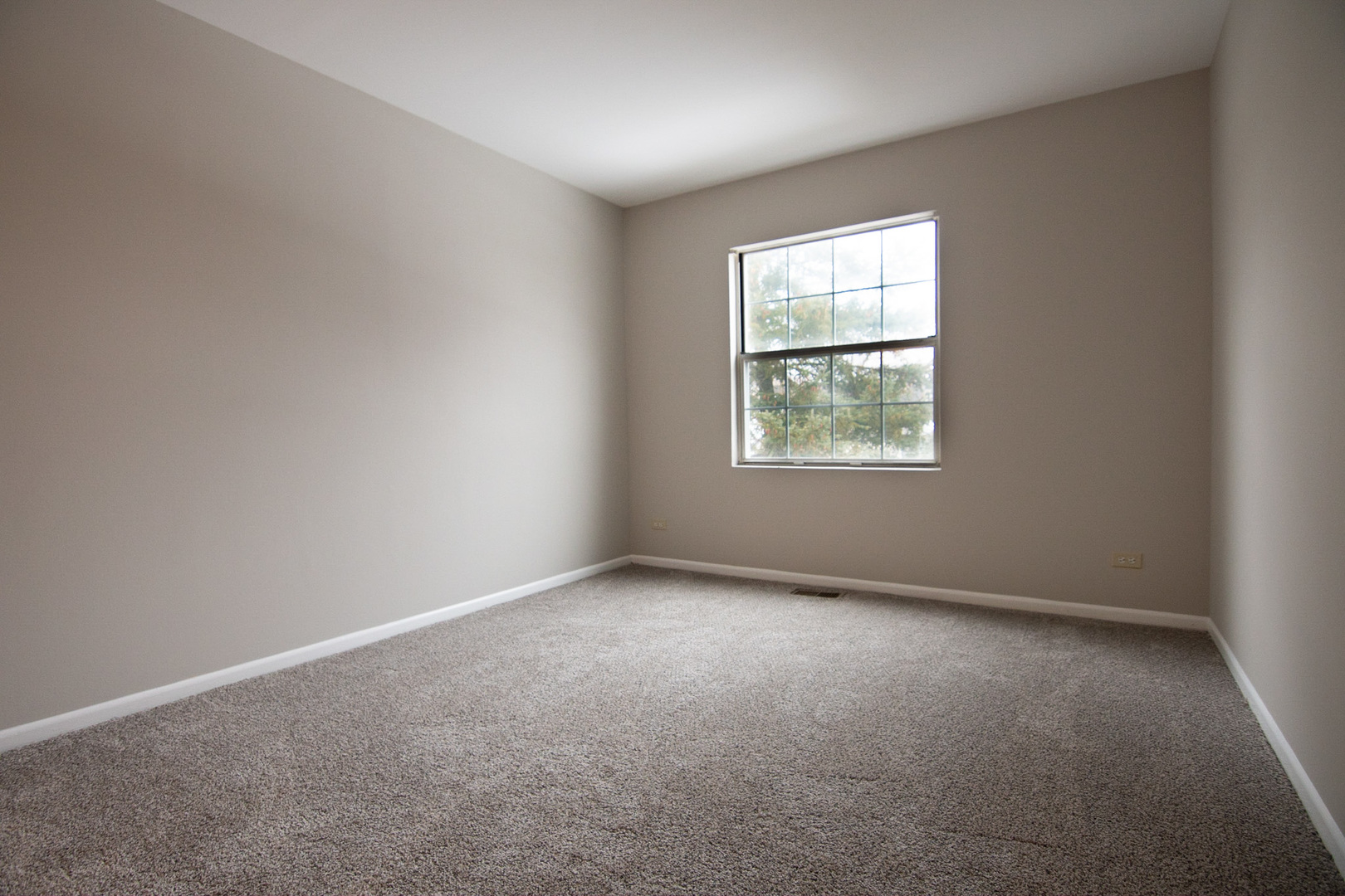 232 Butternut Lane, Unit 232 Streamwood, IL 60107 - Photo 13 of 16 an empty room with a window