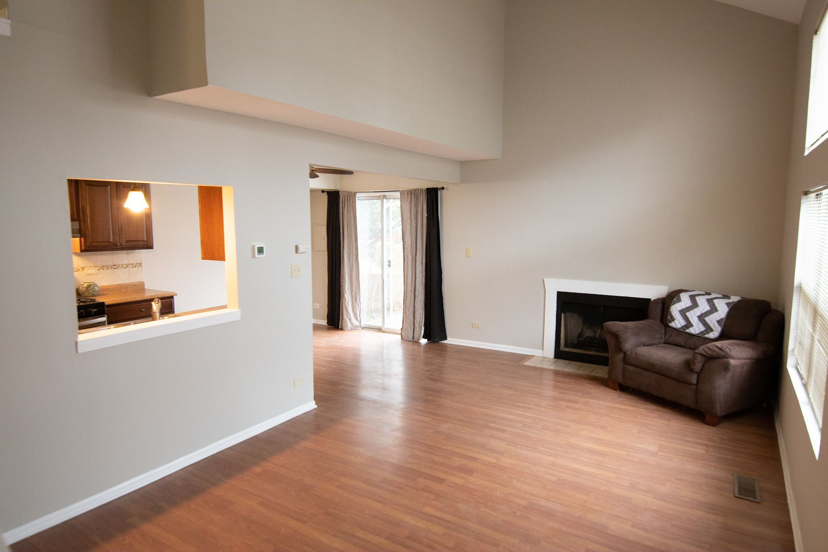 232 Butternut Lane, Unit 232 Streamwood, IL 60107 - Photo 4 of 16 a living room with furniture and a flat screen tv