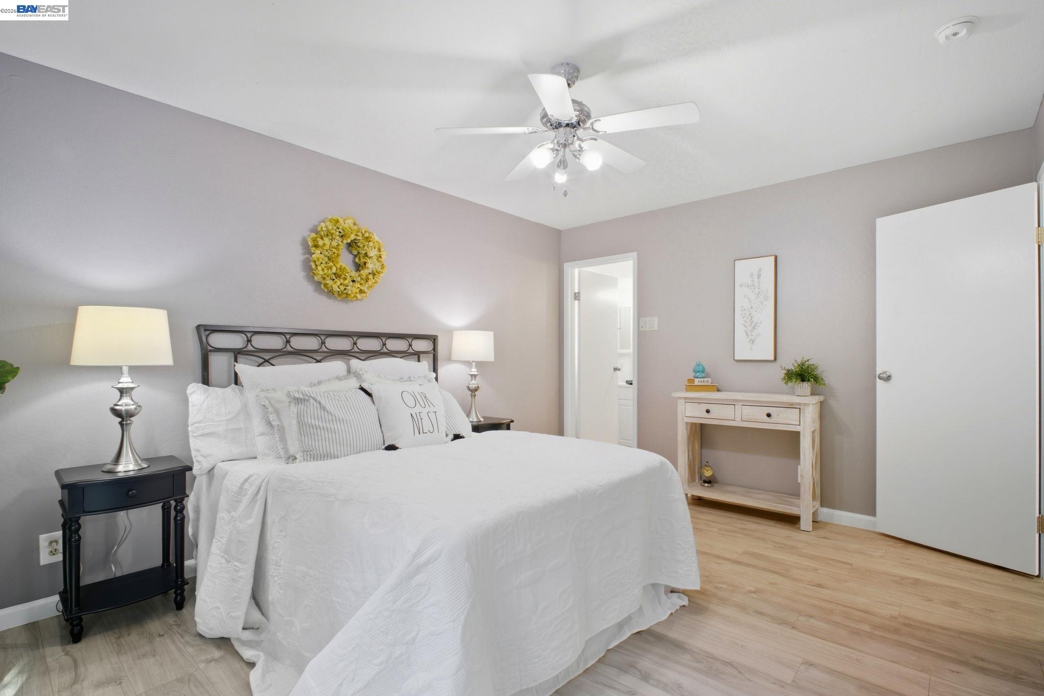 4987 Winchester Place Newark, CA 94560 - Photo 11 of 25 a bedroom with bed and lamps