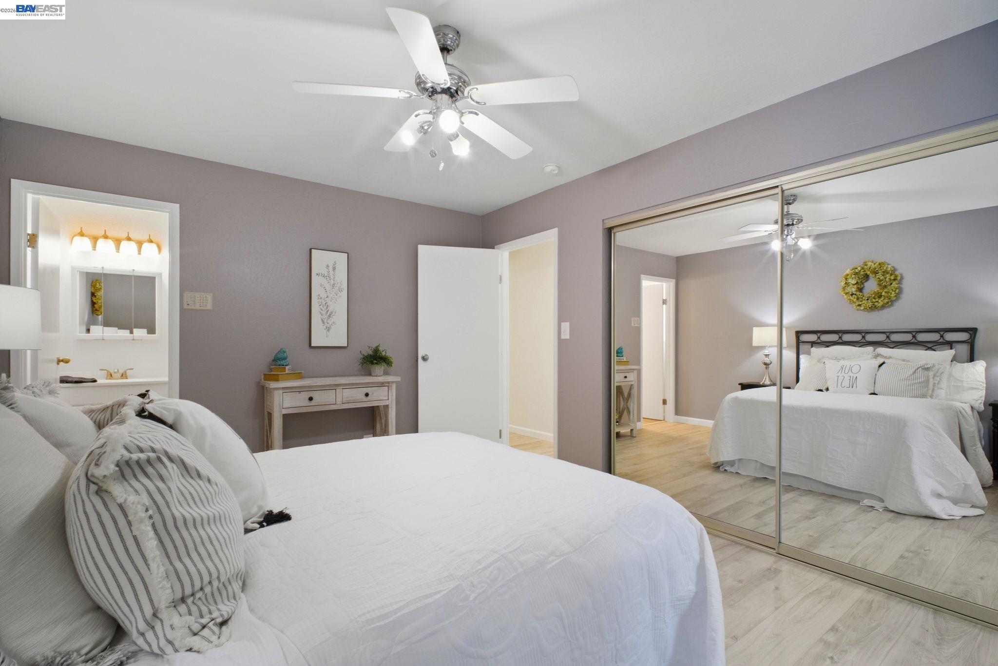 4987 Winchester Place Newark, CA 94560 - Photo 12 of 25 a bedroom with a bed and ceiling fan