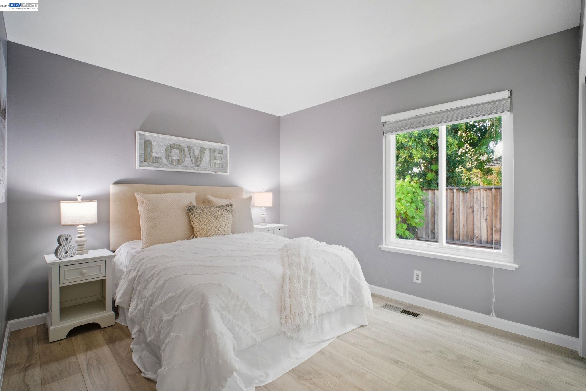 4987 Winchester Place Newark, CA 94560 - Photo 13 of 25 a bedroom with a bed and a window