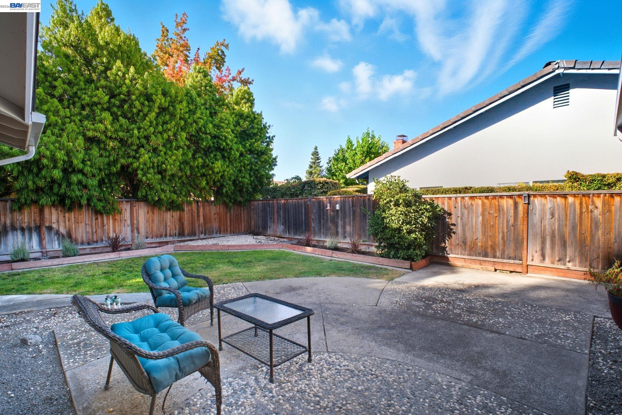 4987 Winchester Place Newark, CA 94560 - Photo 19 of 25 a view of backyard with outdoor seating and green space