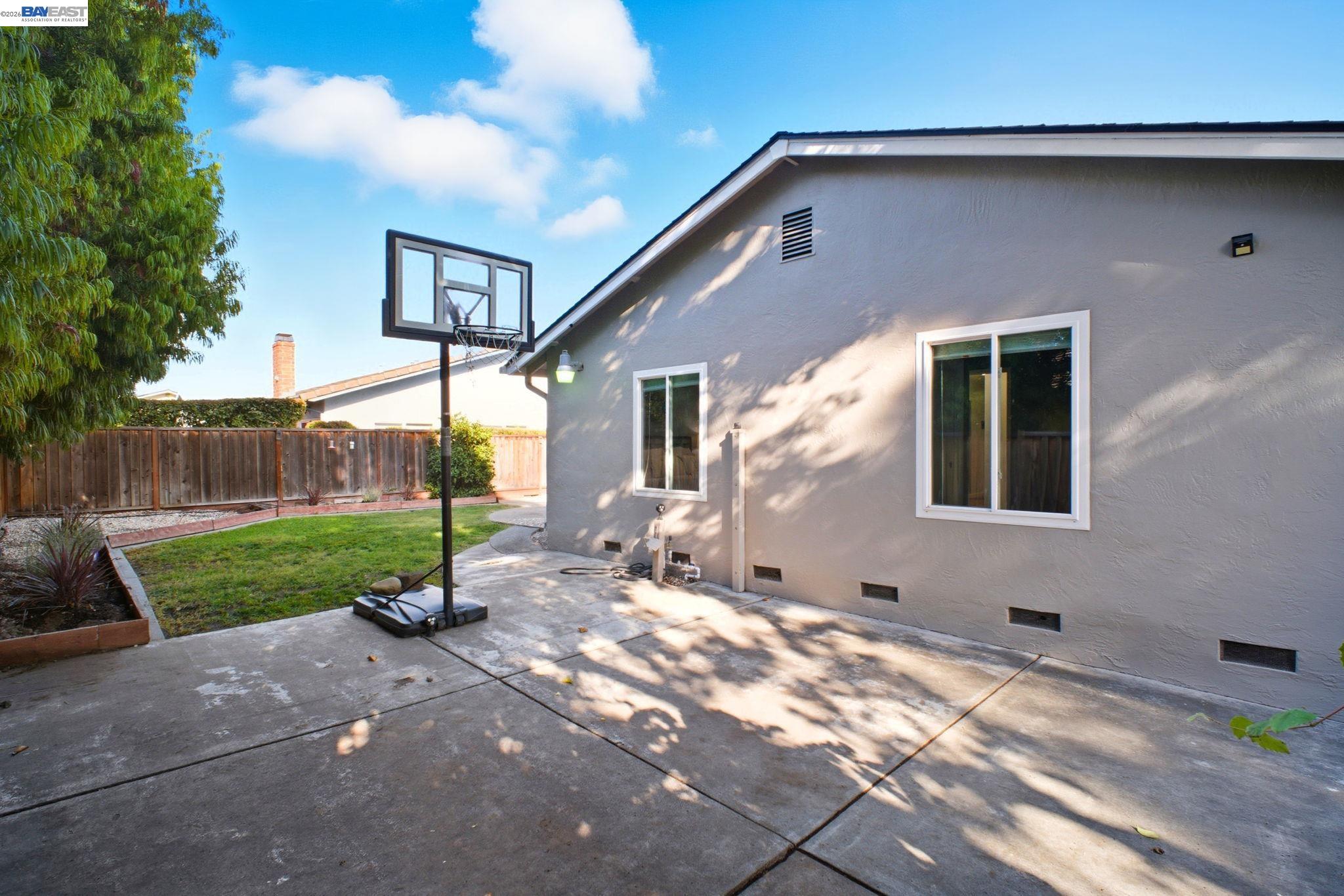4987 Winchester Place Newark, CA 94560 - Photo 23 of 25 a front view of a house with garden