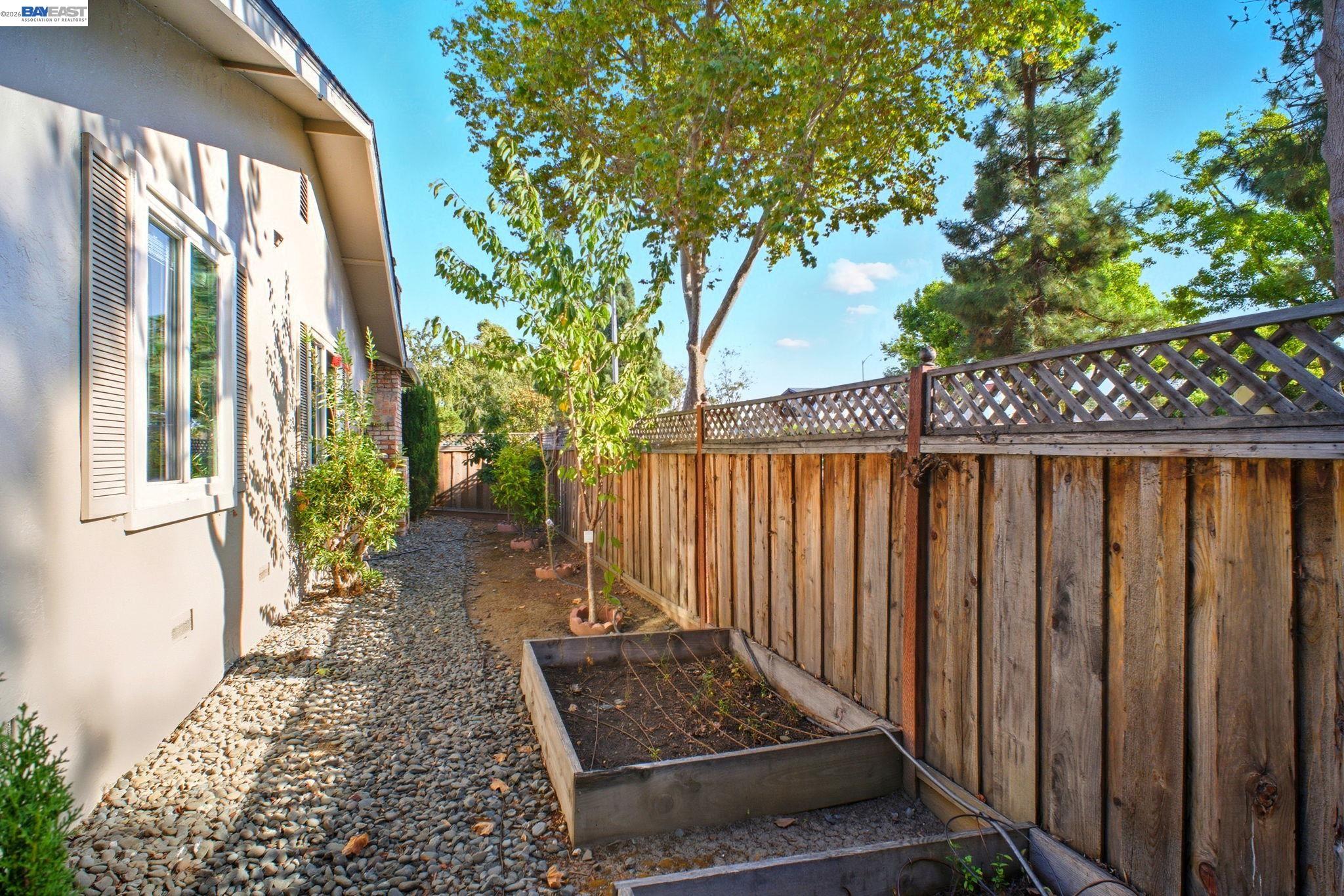4987 Winchester Place Newark, CA 94560 - Photo 24 of 25 a view of a house with a yard