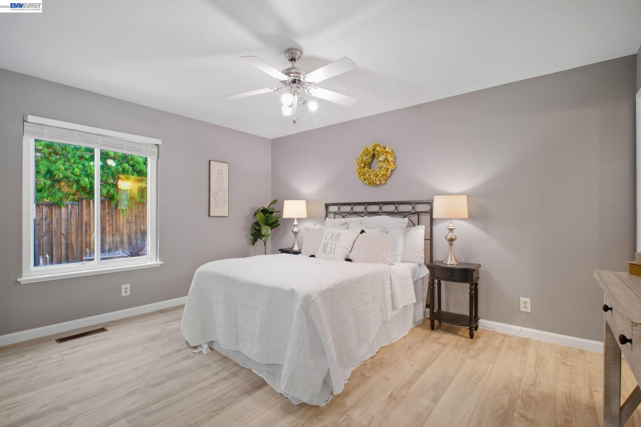 4987 Winchester Place Newark, CA 94560 - Photo 9 of 25 a bedroom with a bed and a window