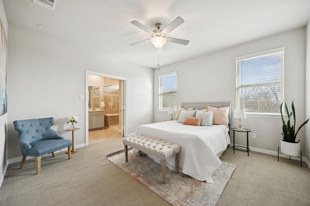 Primary suite is light and bright with french doors to ensuite bathroom