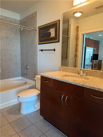a bathroom with a bathtub and shower