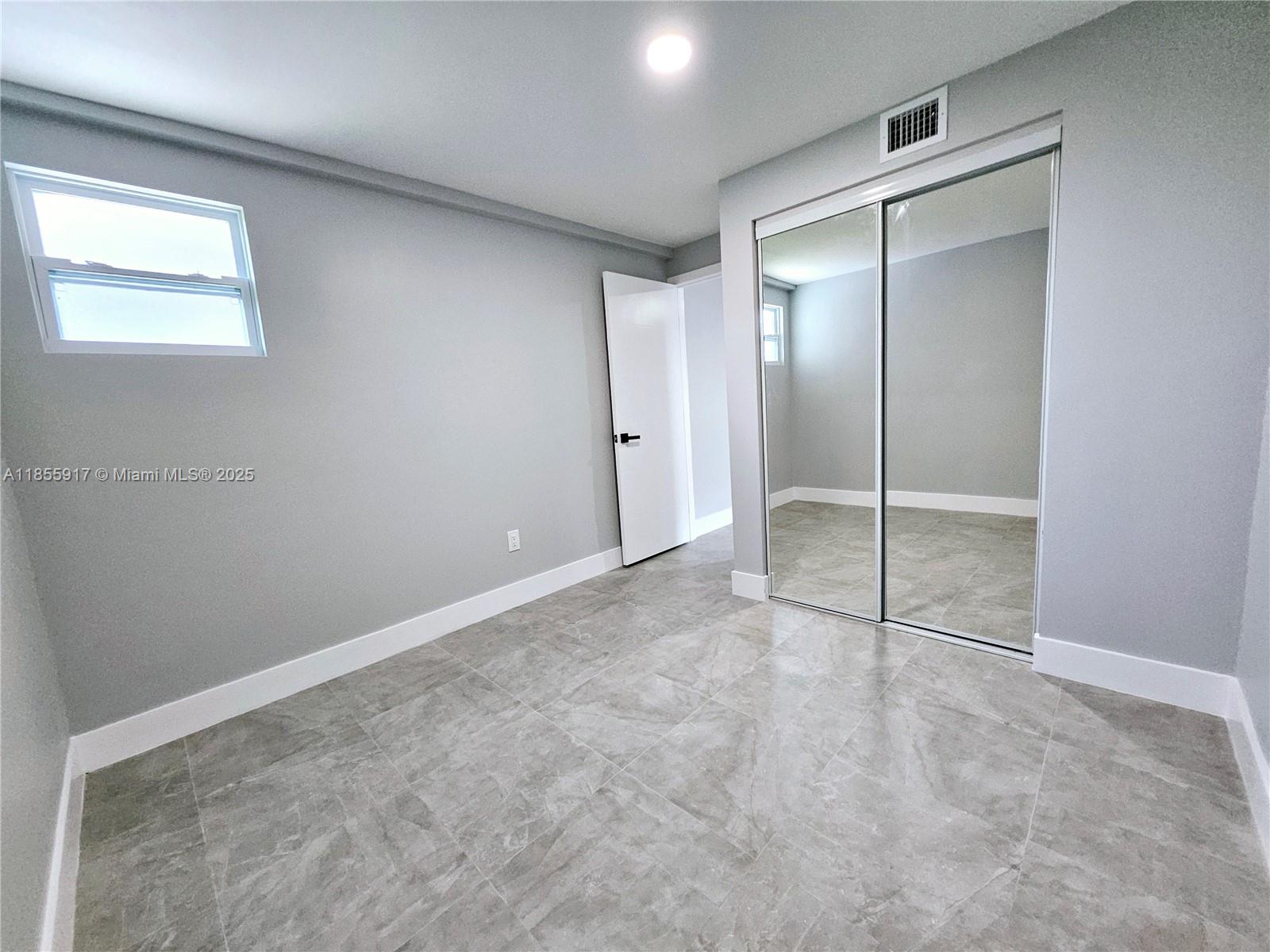 2865 Northeast 13th Avenue Pompano Beach, FL 33064 - Photo 18 of 19 a view of an empty room