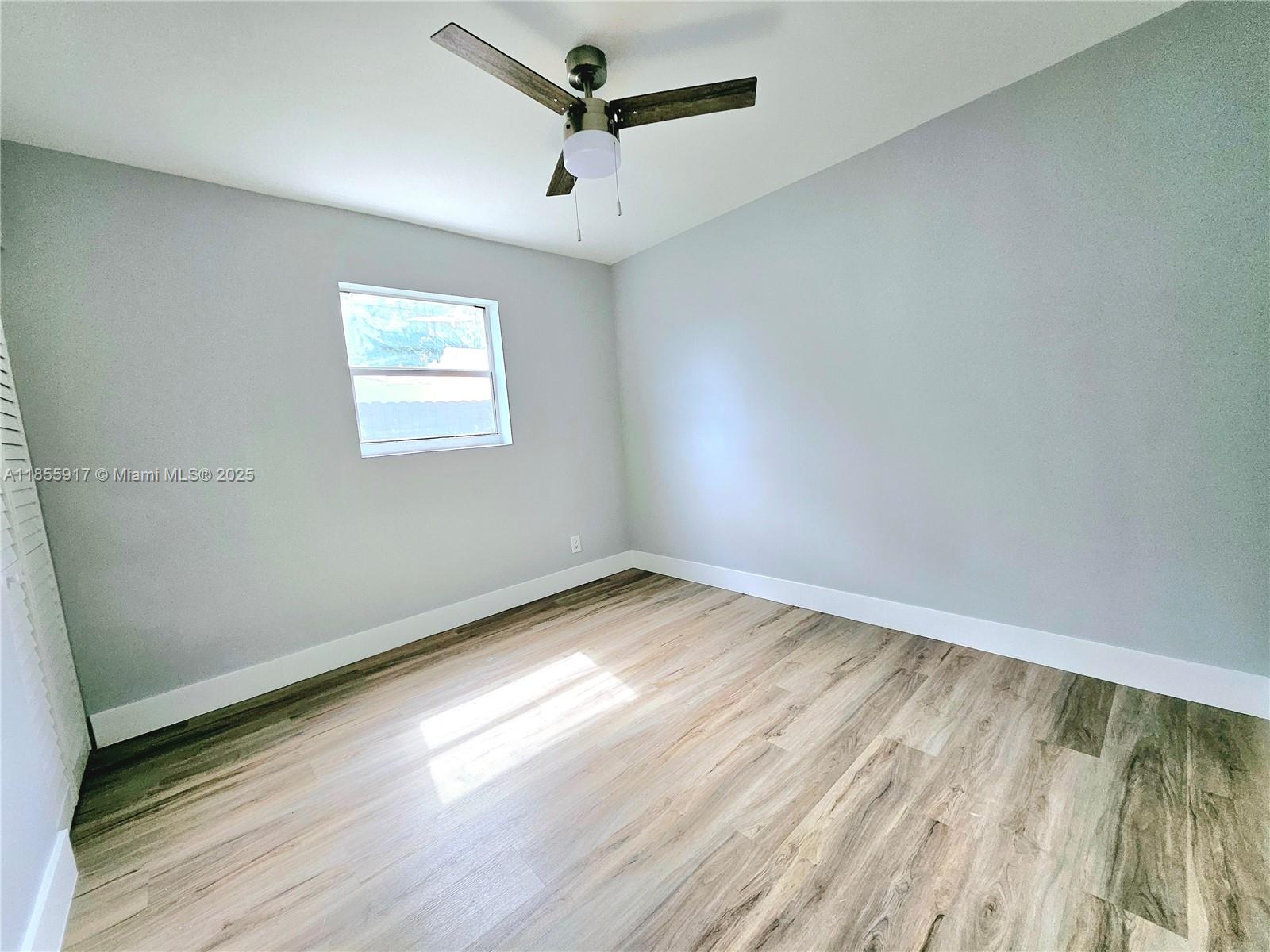 2865 Northeast 13th Avenue Pompano Beach, FL 33064 - Photo 10 of 19 an empty room with a window