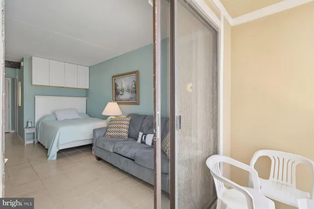 a bedroom with a bed and chair