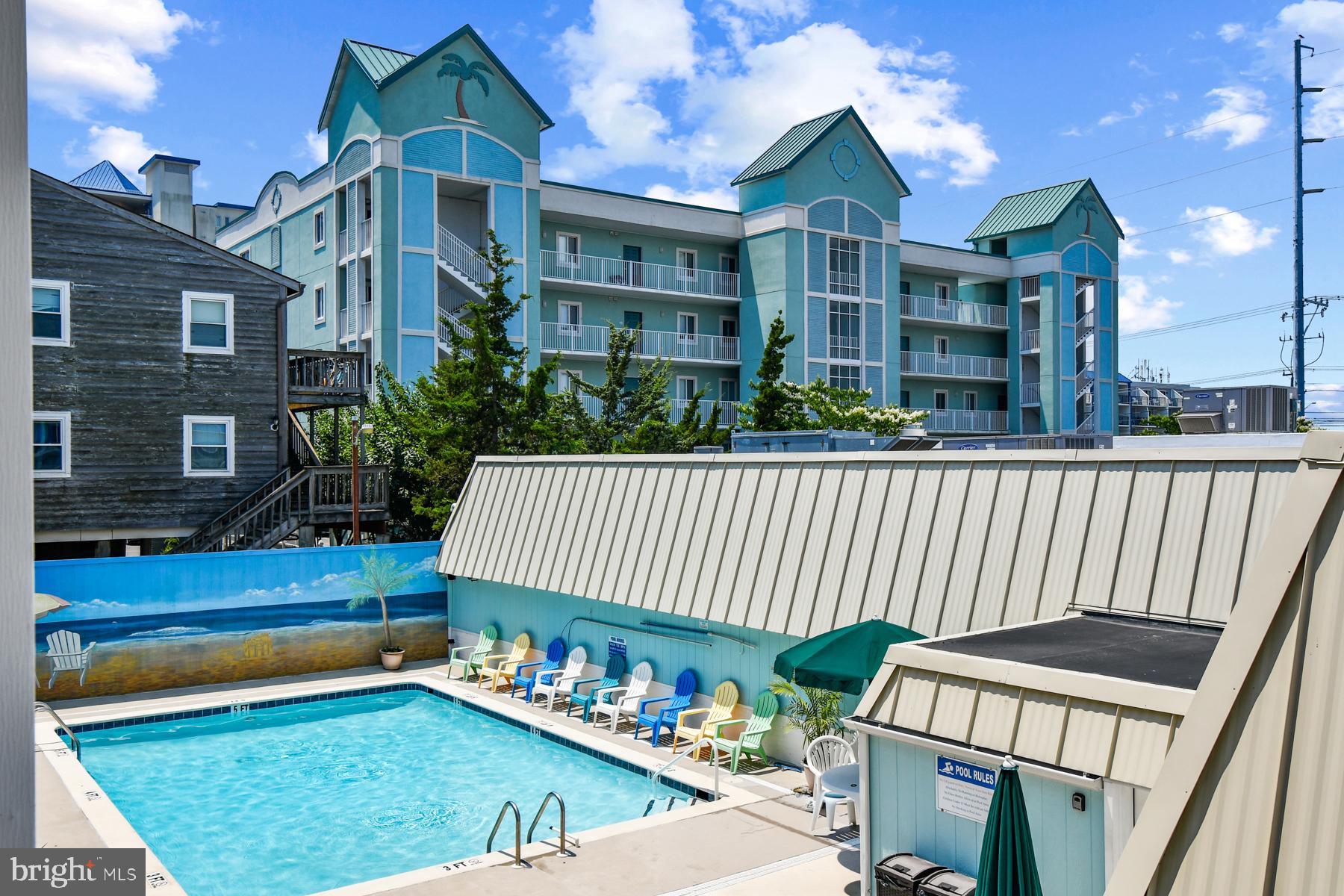 11 62nd Street, Unit 205 Ocean City, MD 21842 - Photo 16 of 18 a front view of a house with garden