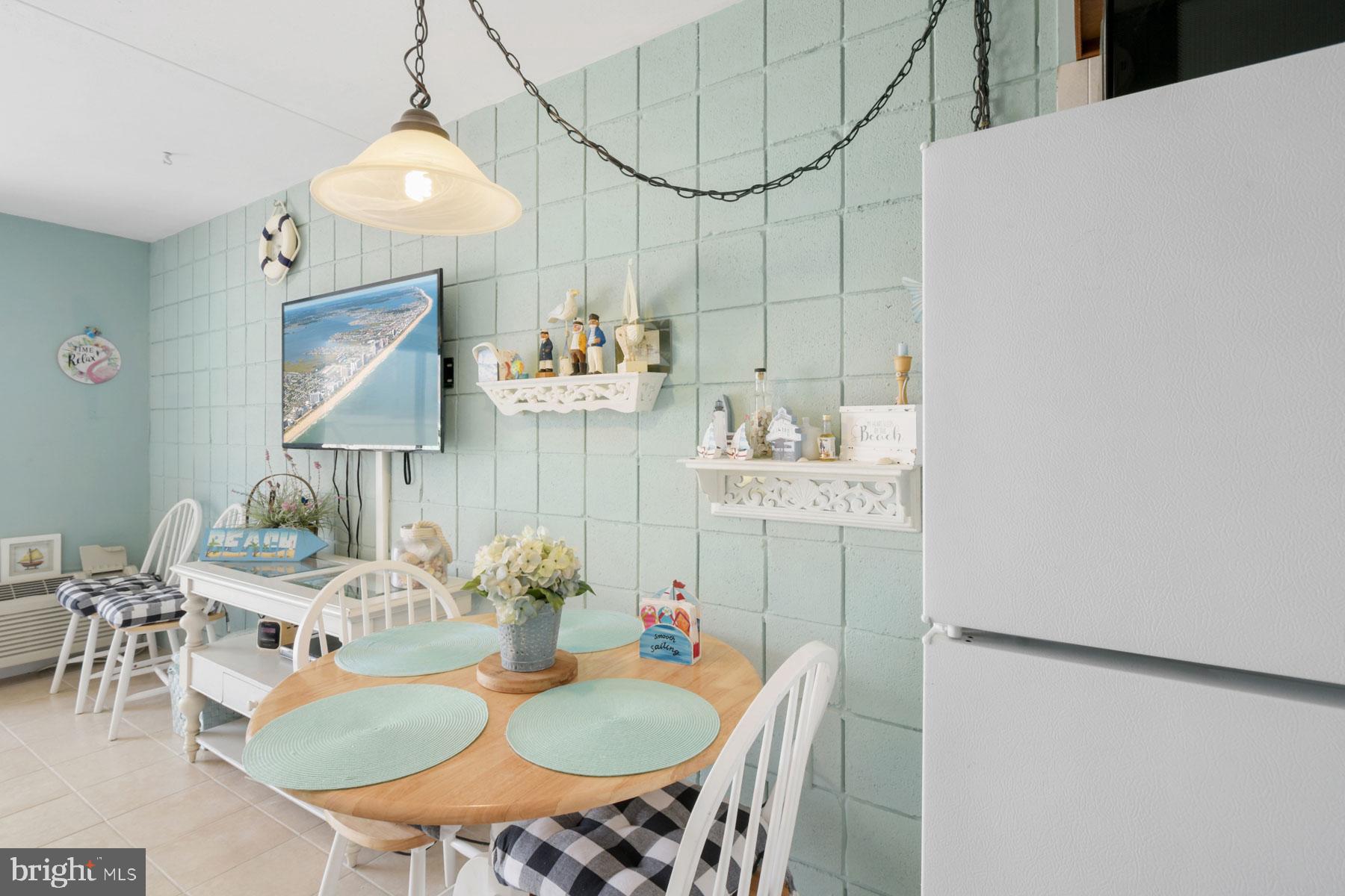 11 62nd Street, Unit 205 Ocean City, MD 21842 - Photo 4 of 18 a view of a dining room with furniture