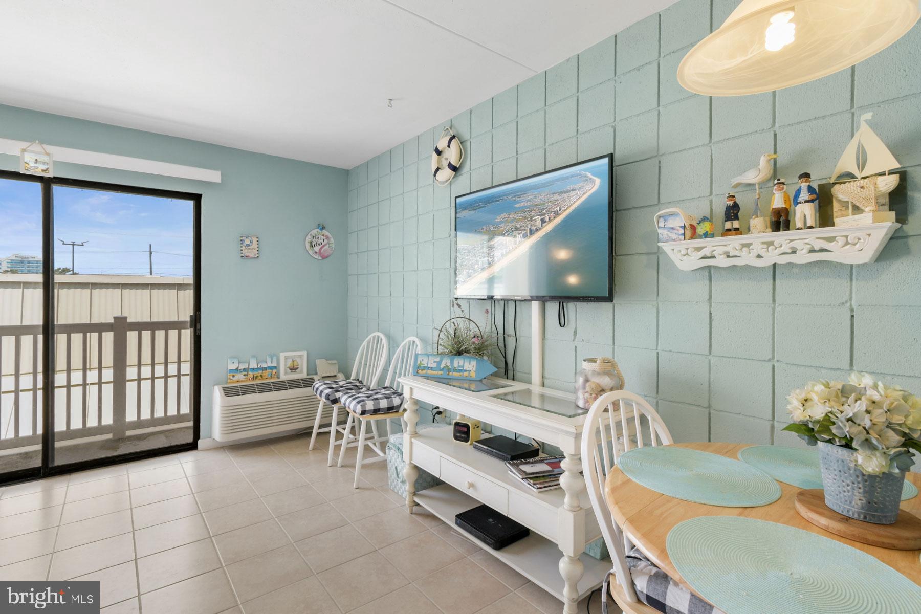 11 62nd Street, Unit 205 Ocean City, MD 21842 - Photo 6 of 18 a dining room with furniture and a window