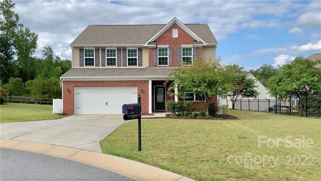 2831 Turquoise Circle Davidson, NC 28036 - Photo 1 of 44 a front view of a house with a yard and garage