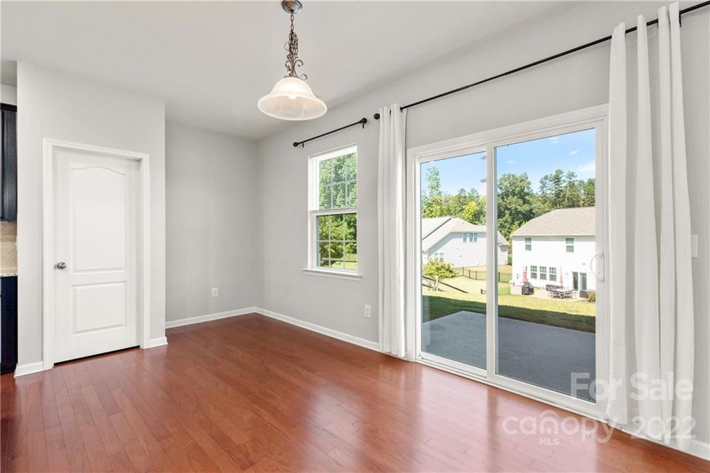 2831 Turquoise Circle Davidson, NC 28036 - Photo 14 of 44 a view of an empty room with wooden floor and a window