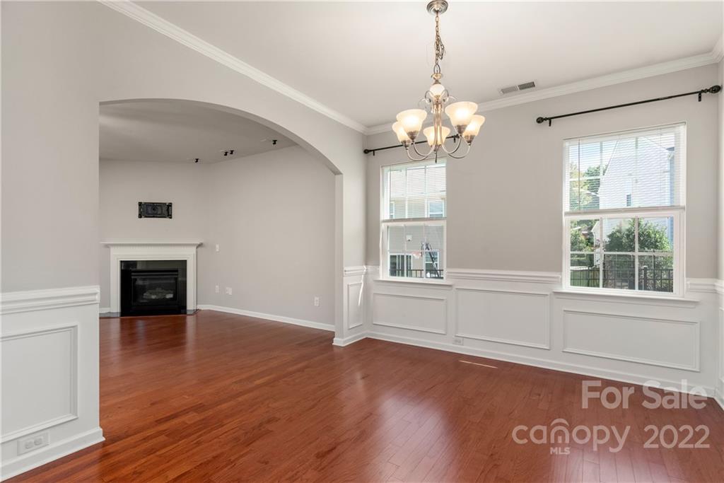 2831 Turquoise Circle Davidson, NC 28036 - Photo 16 of 44 a view of an empty room with a window and wooden floor