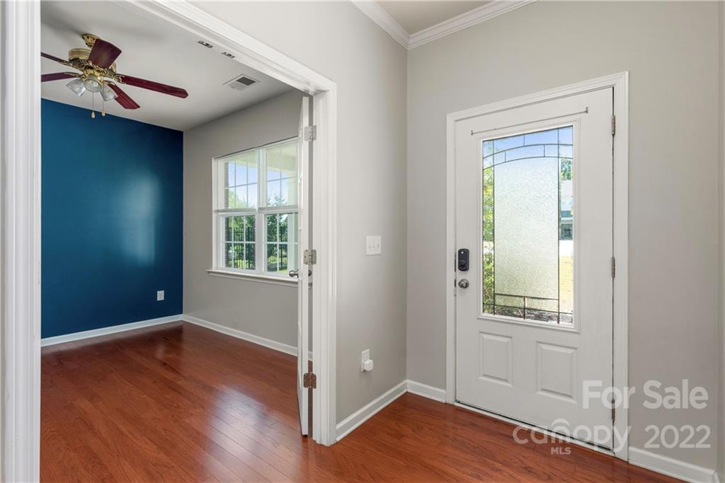 2831 Turquoise Circle Davidson, NC 28036 - Photo 2 of 44 a view of an empty room with wooden floor and a window
